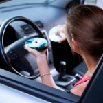 Woman Changing CD's in the car